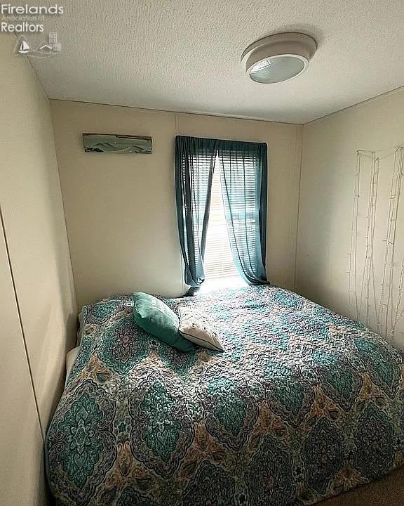 3575 NE Catawba Rd Unit 5, Port Clinton, OH 43452 - bedroom with a textured ceiling