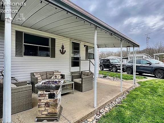 3575 NE Catawba Rd Unit 5, Port Clinton, OH 43452 - view of patio / terrace featuring an outdoor living space with a fire pit