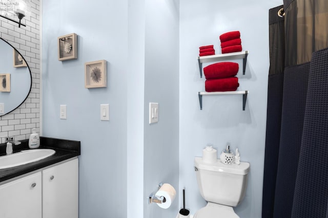 1807 E Perry St Unit 69, Port Clinton, OH 43452 - bathroom with vanity, backsplash, toilet, and curtained shower