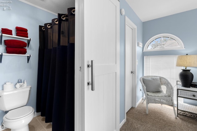 1807 E Perry St Unit 69, Port Clinton, OH 43452 - full bath featuring toilet, curtained shower, and baseboards