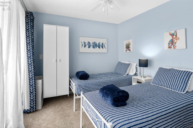 1807 E Perry St Unit 69, Port Clinton, OH 43452 - carpeted bedroom with ceiling fan and a closet
