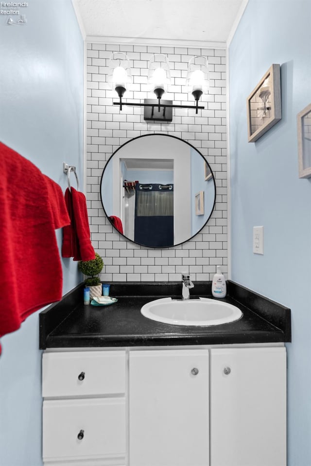 1807 E Perry St Unit 69, Port Clinton, OH 43452 - bathroom with vanity, decorative backsplash, and crown molding