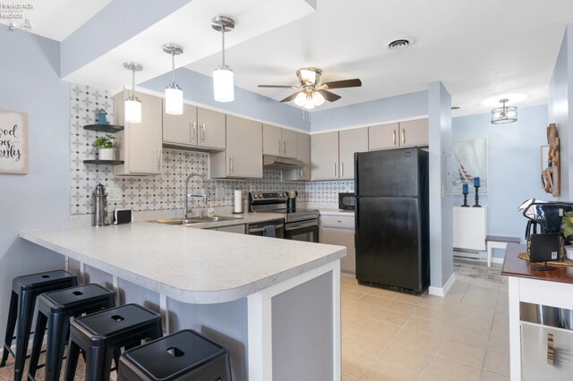1807 E Perry St Unit 69, Port Clinton, OH 43452 - kitchen with electric range, freestanding refrigerator, a peninsula, a sink, and backsplash