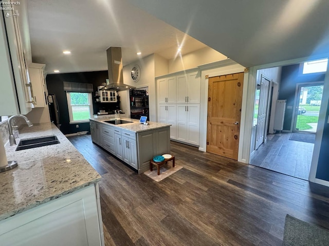 505 E Stoneplace Dr, Sandusky, OH 44870 - kitchen with island range hood, a sink, black electric stovetop, white cabinetry, and dark wood-type flooring