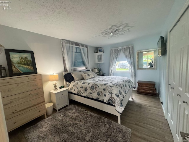 505 E Stoneplace Dr, Sandusky, OH 44870 - bedroom with dark wood finished floors and a textured ceiling