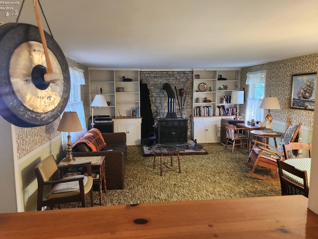 635 Walnut Ave, Lakeside, OH 43440 - living room with a wood stove and wallpapered walls
