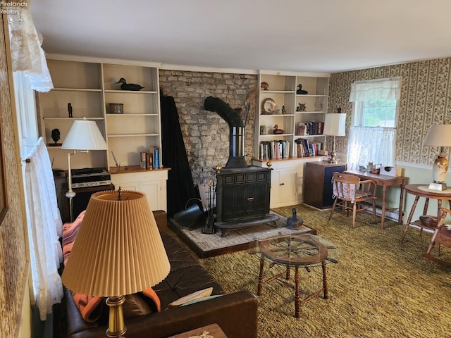 635 Walnut Ave, Lakeside, OH 43440 - living room featuring wallpapered walls and a wood stove