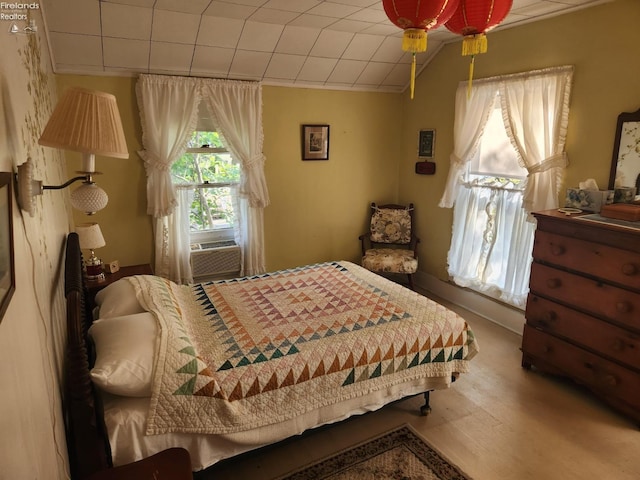 635 Walnut Ave, Lakeside, OH 43440 - bedroom with wood finished floors and cooling unit