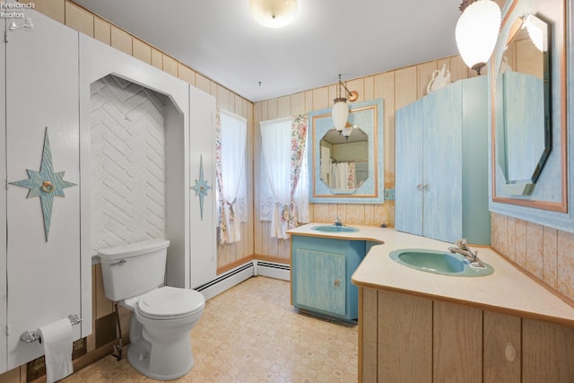 1450 Claus Rd, Vermilion, OH 44089 - full bath with a baseboard radiator, vanity, and tile patterned floors