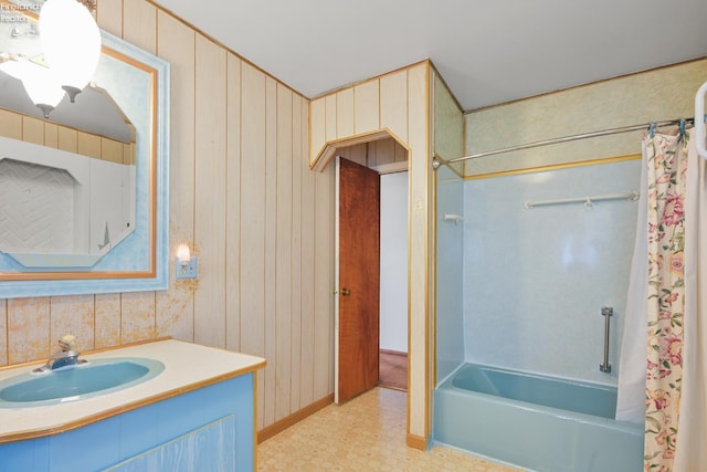 1450 Claus Rd, Vermilion, OH 44089 - bathroom featuring shower / bath combination with curtain, vanity, and wooden walls