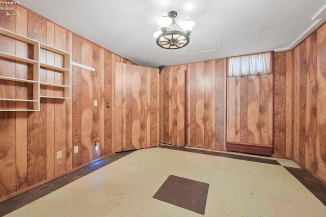 1450 Claus Rd, Vermilion, OH 44089 - spare room featuring wooden walls and tile patterned floors