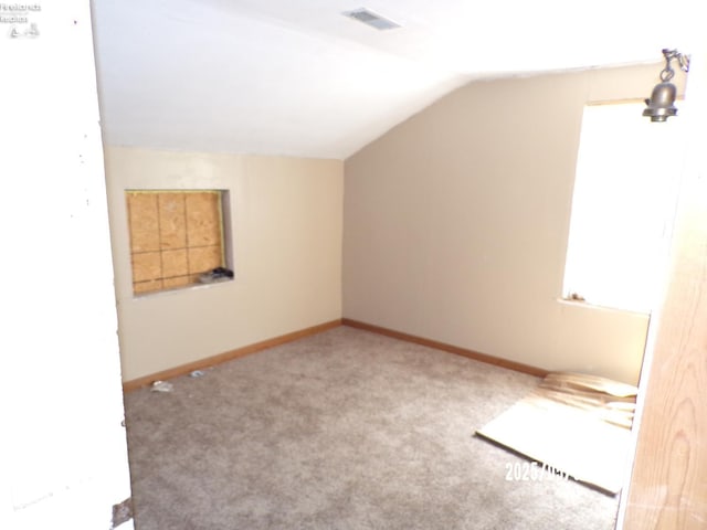 118 E Buckeye St, Clyde, OH 43410 - bonus room featuring lofted ceiling, carpet, and baseboards