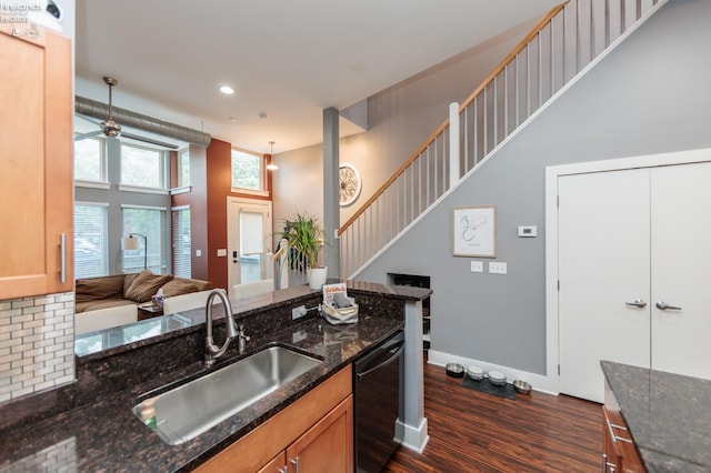 1402 Newman Ave, Lakewood, OH 44107 - kitchen with dark wood finished floors, dishwasher, dark stone countertops, recessed lighting, and open floor plan