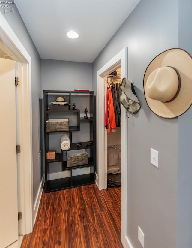 1402 Newman Ave, Lakewood, OH 44107 - hall featuring dark wood-type flooring and baseboards