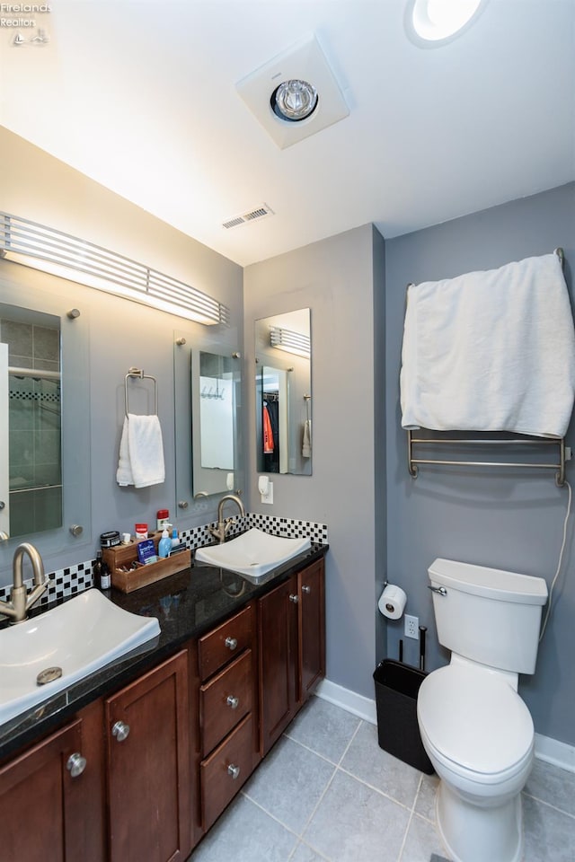 1402 Newman Ave, Lakewood, OH 44107 - bathroom with double vanity, tile patterned flooring, and backsplash