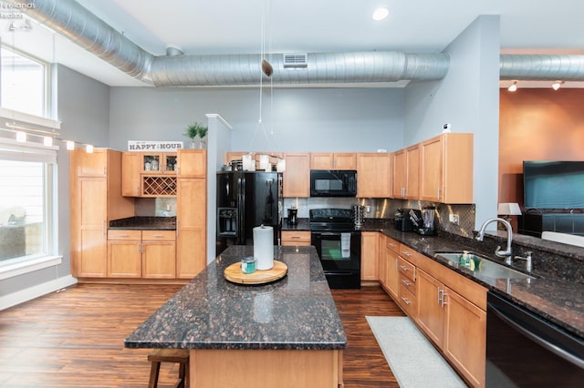 1402 Newman Ave, Lakewood, OH 44107 - kitchen featuring black appliances, a high ceiling, backsplash, light brown cabinetry, and dark wood-style floors