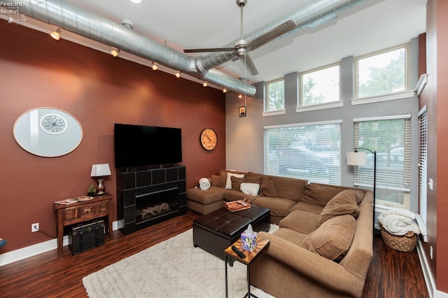 1402 Newman Ave, Lakewood, OH 44107 - living room with a towering ceiling, wood finished floors, ceiling fan, and a fireplace