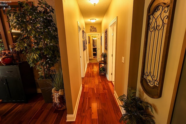 3826 Windsor Bridge Cir, Huron, OH 44839 - hallway featuring dark wood-style floors