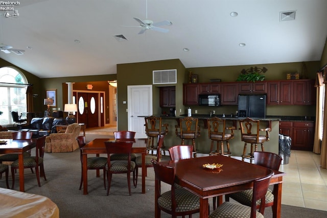 3826 Windsor Bridge Cir, Huron, OH 44839 - dining room featuring a ceiling fan, light colored carpet, and high vaulted ceiling