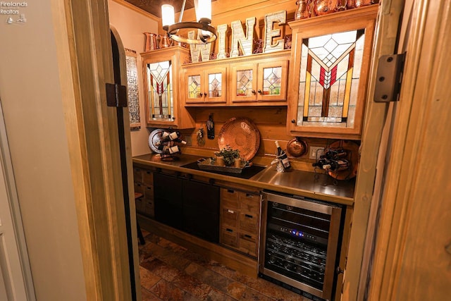 3826 Windsor Bridge Cir, Huron, OH 44839 - indoor bar featuring wine cooler, arched walkways, brick patterned flooring, and a chandelier