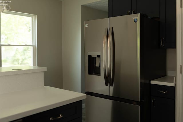 15 Abbott St, Wakeman, OH 44889 - kitchen featuring stainless steel refrigerator with ice dispenser, dark cabinetry, and light countertops