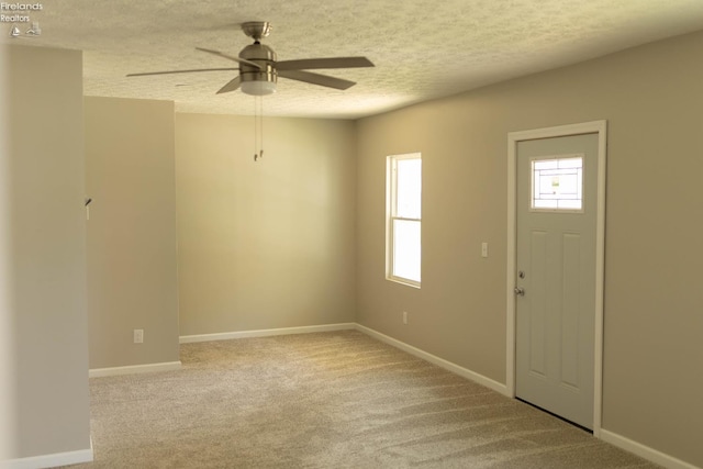 15 Abbott St, Wakeman, OH 44889 - carpeted entrance foyer featuring ceiling fan and a textured ceiling
