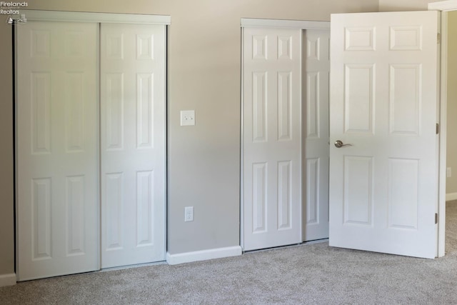 15 Abbott St, Wakeman, OH 44889 - unfurnished bedroom with carpet floors and two closets