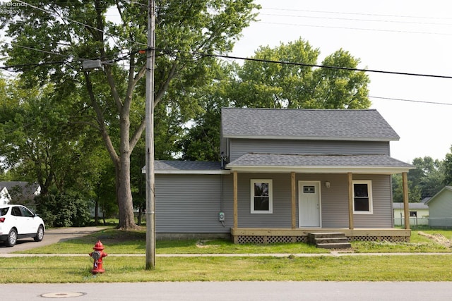 15 Abbott St, Wakeman, OH 44889 - bungalow-style house with a porch, a front yard, and roof with shingles