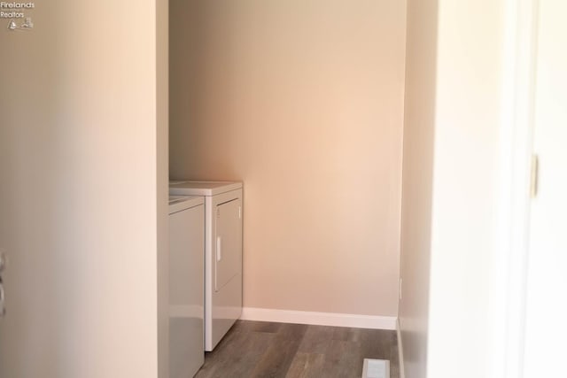 15 Abbott St, Wakeman, OH 44889 - laundry room with washing machine and dryer and dark wood-style flooring
