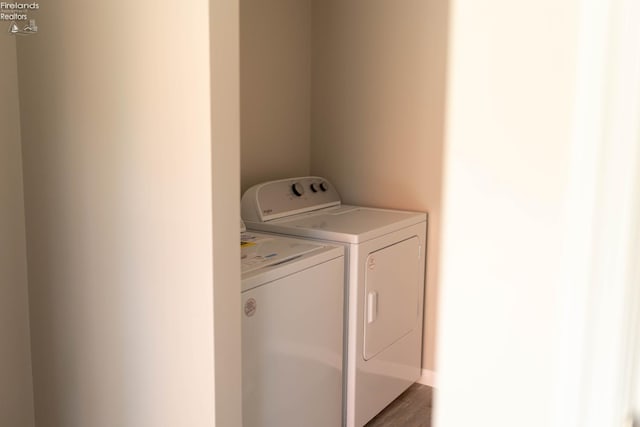 15 Abbott St, Wakeman, OH 44889 - laundry room featuring washing machine and clothes dryer and light wood-style flooring