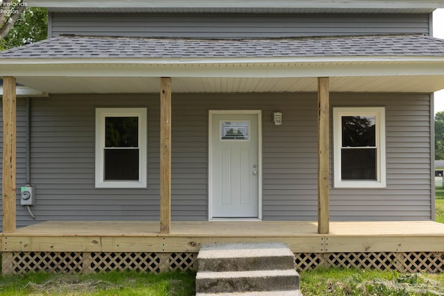 15 Abbott St, Wakeman, OH 44889 - entrance to property featuring roof with shingles and covered porch