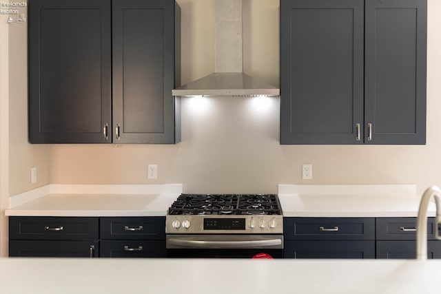 15 Abbott St, Wakeman, OH 44889 - kitchen with wall chimney exhaust hood, stainless steel gas range oven, and light countertops