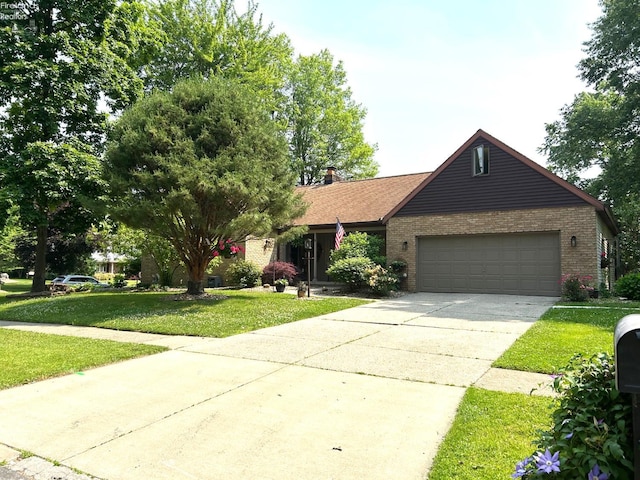 9 Eagle Way, Norwalk, OH 44857 - ranch-style house featuring brick siding, a garage, a front lawn, and concrete driveway