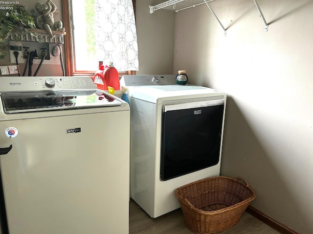 9 Eagle Way, Norwalk, OH 44857 - laundry area with independent washer and dryer and wood finished floors
