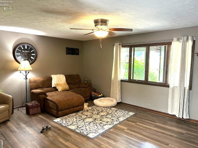 9 Eagle Way, Norwalk, OH 44857 - living area featuring wood finished floors, a ceiling fan, and a textured ceiling