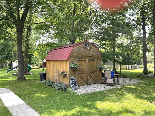 9 Eagle Way, Norwalk, OH 44857 - view of shed with a playground and view of wooded area