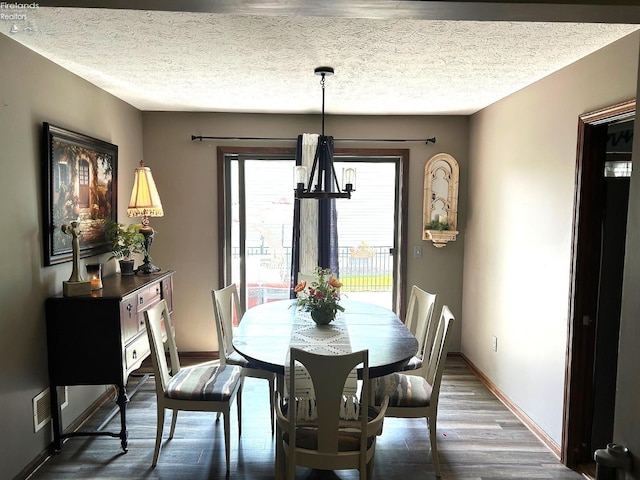 9 Eagle Way, Norwalk, OH 44857 - dining space with dark wood-style flooring and a textured ceiling