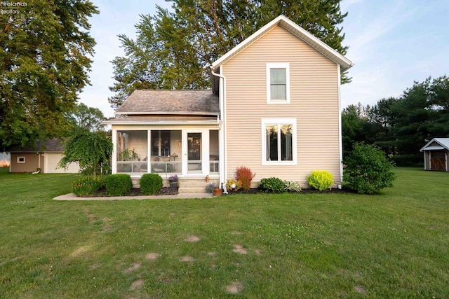 4647 Crk 175, Clyde, OH 43410 - back of house featuring a sunroom, a yard, and roof with shingles