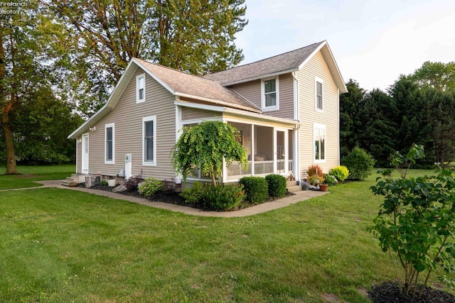 4647 Crk 175, Clyde, OH 43410 - view of home's exterior with a sunroom, a lawn, and roof with shingles