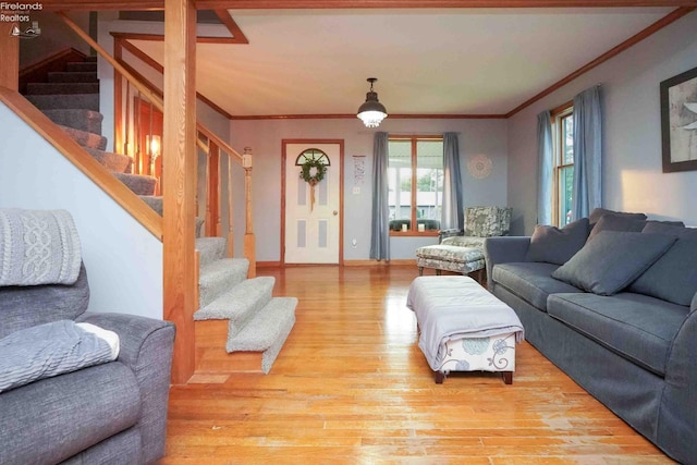 4647 Crk 175, Clyde, OH 43410 - living room featuring light wood finished floors, crown molding, and stairs