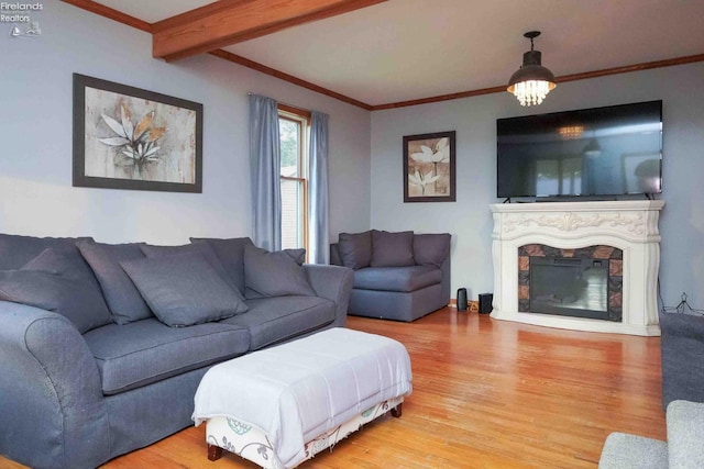 4647 Crk 175, Clyde, OH 43410 - living area with light wood-style flooring, crown molding, a glass covered fireplace, and beam ceiling