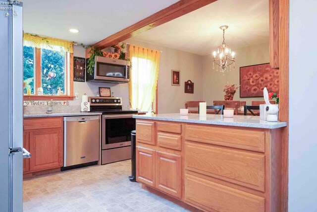 4647 Crk 175, Clyde, OH 43410 - kitchen featuring appliances with stainless steel finishes, a chandelier, recessed lighting, pendant lighting, and light stone countertops