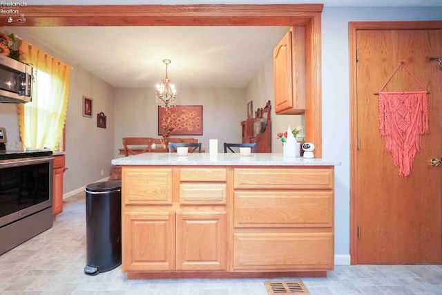 4647 Crk 175, Clyde, OH 43410 - kitchen with stainless steel appliances, a peninsula, a chandelier, and light countertops