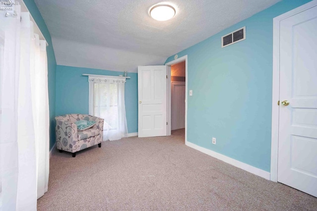 4647 Crk 175, Clyde, OH 43410 - living area featuring carpet, a textured ceiling, and lofted ceiling