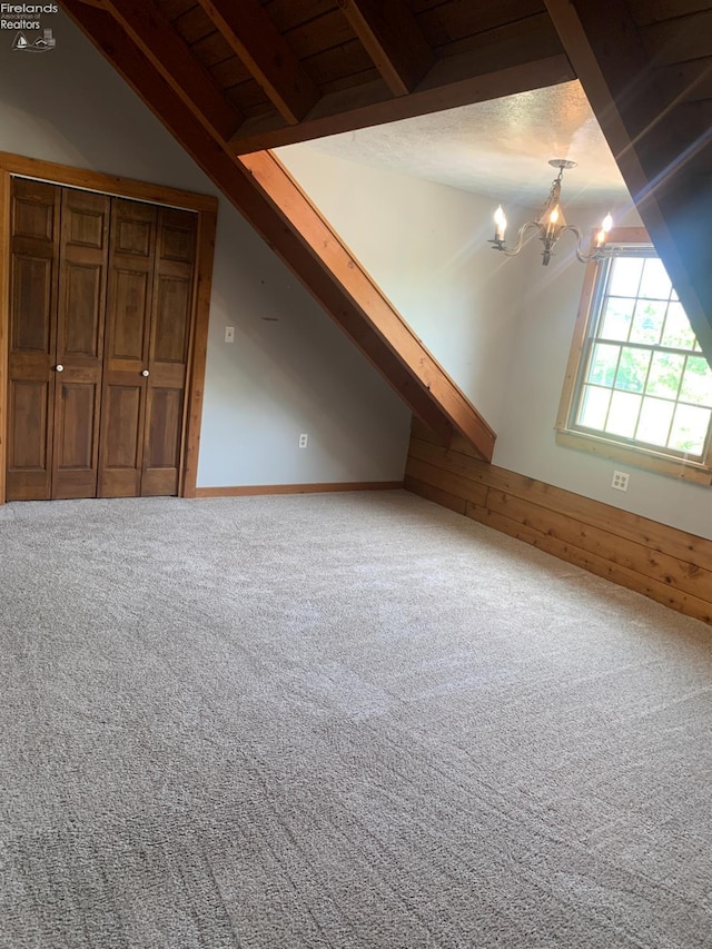 37 State Route 60, New London, OH 44851 - bonus room featuring a chandelier, carpet flooring, and wooden walls