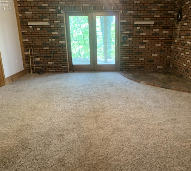 37 State Route 60, New London, OH 44851 - empty room with carpet flooring and brick wall