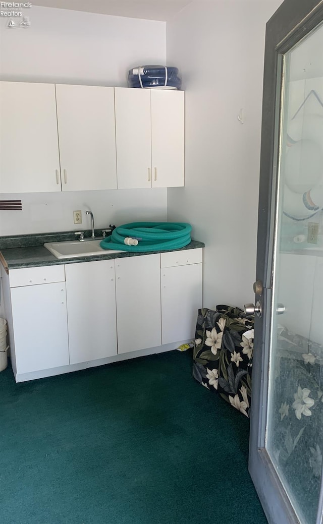 37 State Route 60, New London, OH 44851 - kitchen with white cabinetry and dark carpet