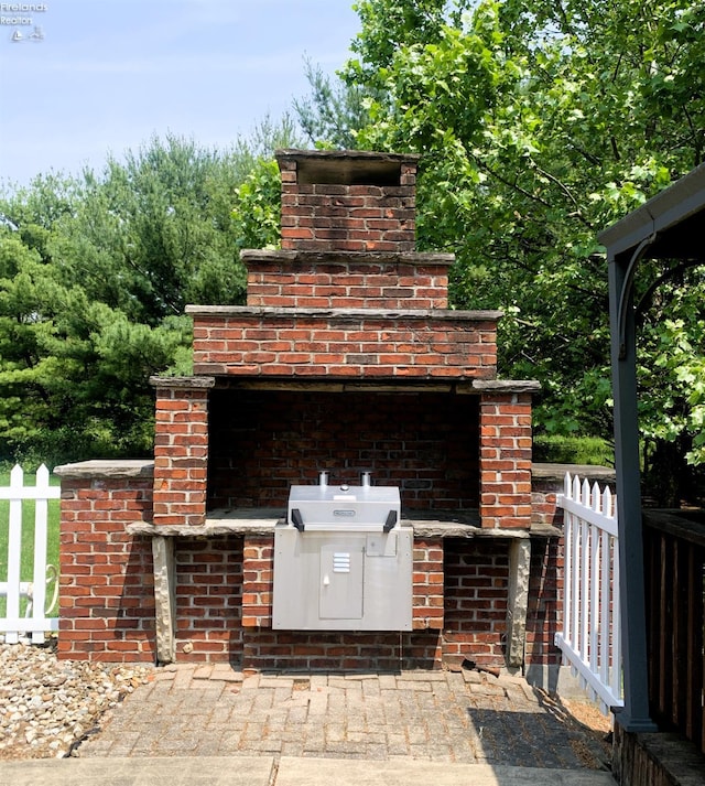 37 State Route 60, New London, OH 44851 - view of patio featuring exterior kitchen and an outdoor brick fireplace