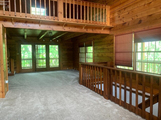 37 State Route 60, New London, OH 44851 - empty room with wood walls and carpet floors