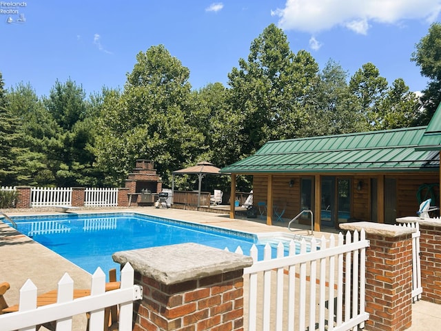 37 State Route 60, New London, OH 44851 - view of swimming pool featuring an outdoor fireplace and a patio